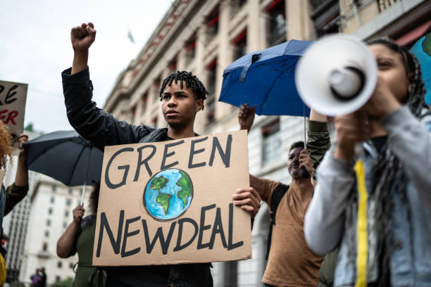 istock Protests holding signs during on a demostration for environmentalism 1385766502