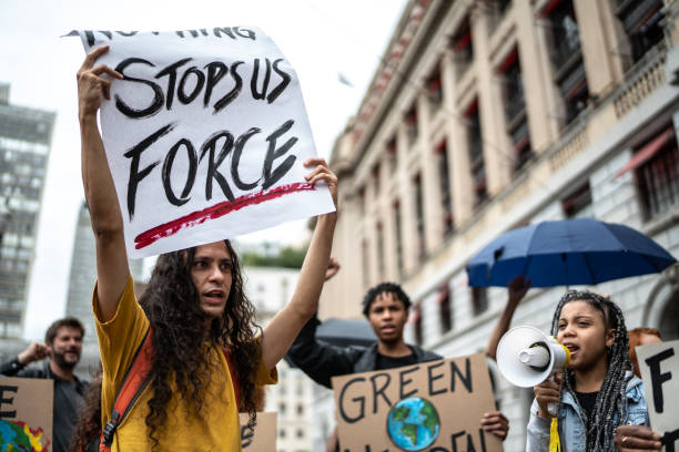 istock Protests holding signs during on a demostration for environmentalism 1385766515