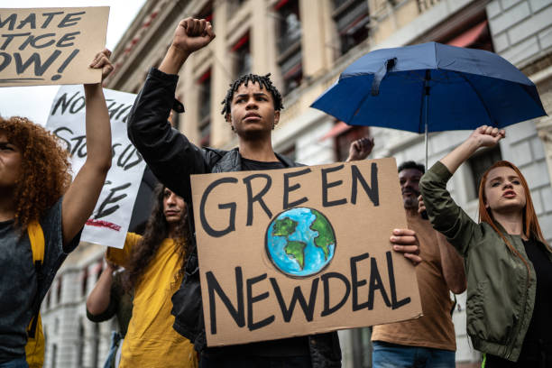 istock Protests holding signs during on a demostration for environmentalism 1385767047
