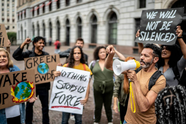 istock Protests holding signs during on a demonstration for environmentalism 1385767048
