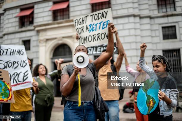 Protests Holding Signs During On A Demonstration Stock Photo - Download Image Now - Protest, Climate, Climate Change