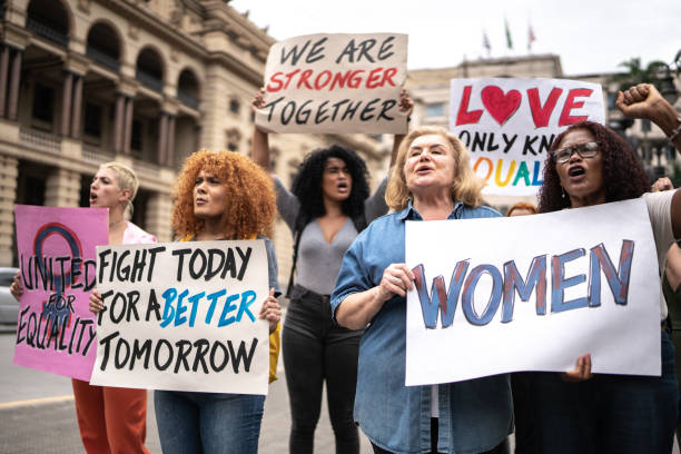 Protests holding signs during on a demonstration for equal rights