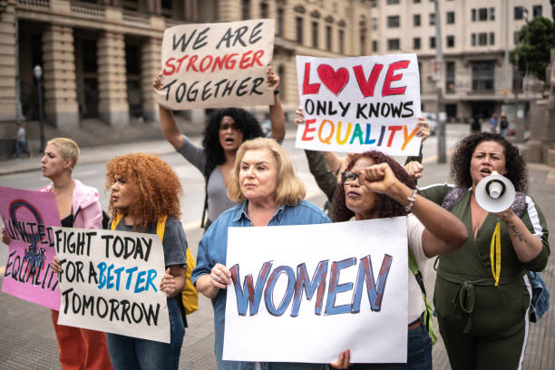 istock Protests holding signs during on a demonstration for equal rights 1385767099