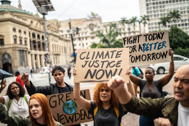 istock Protests holding signs during on a demostration for environmentalism 1385767105