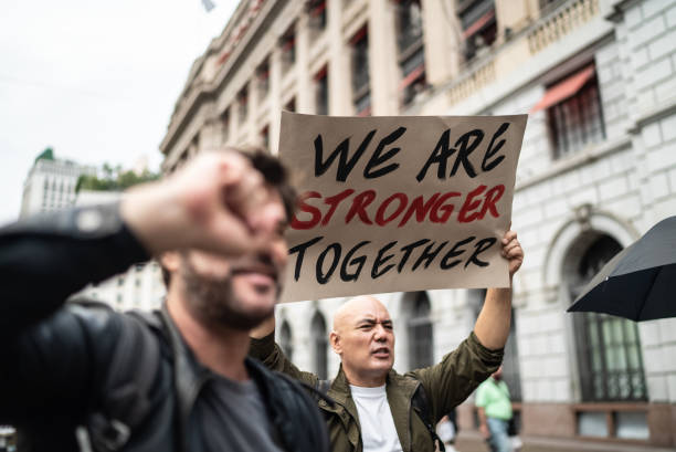 istock Protests holding signs during on a demonstration outdoors 1385767116