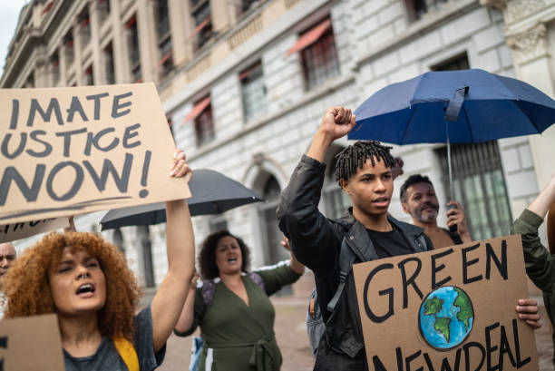 istock Protests holding signs during on a demostration for environmentalism 1385767118