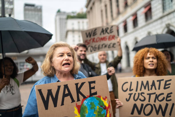 istock Protests holding signs during on a demostration for environmentalism 1385767126