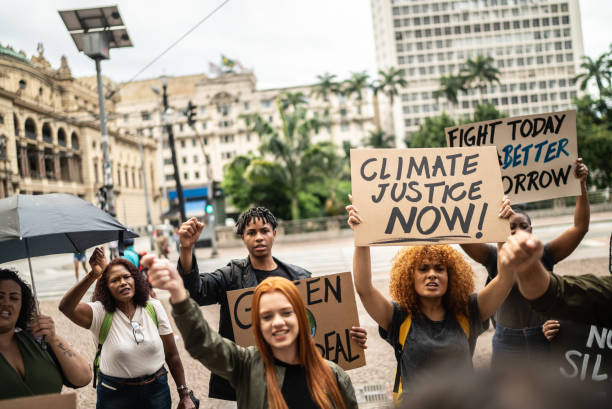 istock Protests holding signs during on a demostration for environmentalism 1385767133