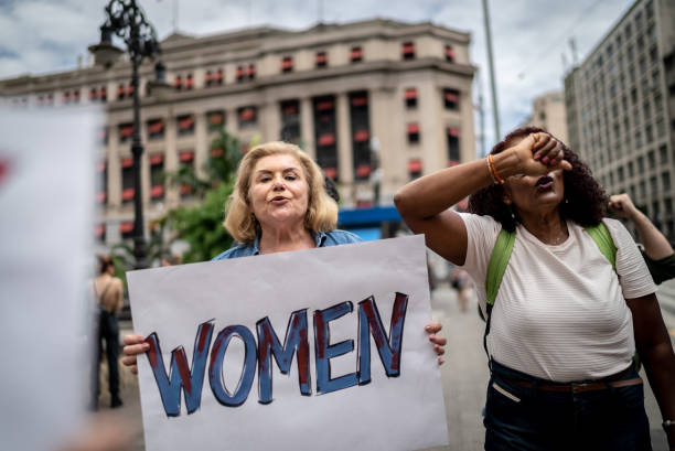 istock Protests holding signs during on a demonstration for equal rights 1385767145