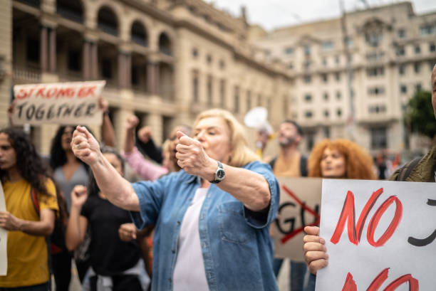 istock Protests holding signs during on a demonstration outdoors 1385767147
