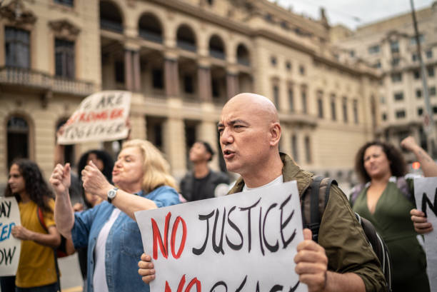 istock Protests holding signs during on a demonstration outdoors 1385767148