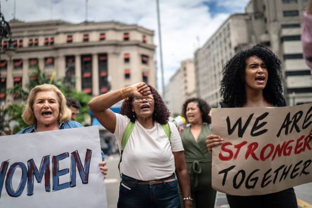 istock Protests holding signs during on a demonstration for equal rights 1385767155