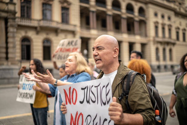 istock Protests holding signs during on a demonstration outdoors 1385767157