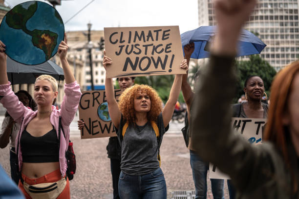 istock Protests holding signs during on a demonstration for environmentalism 1385767353