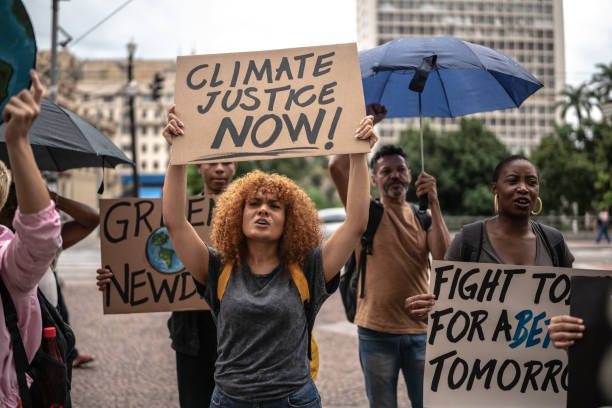 istock Protests holding signs during on a demonstration for environmentalism 1385767356