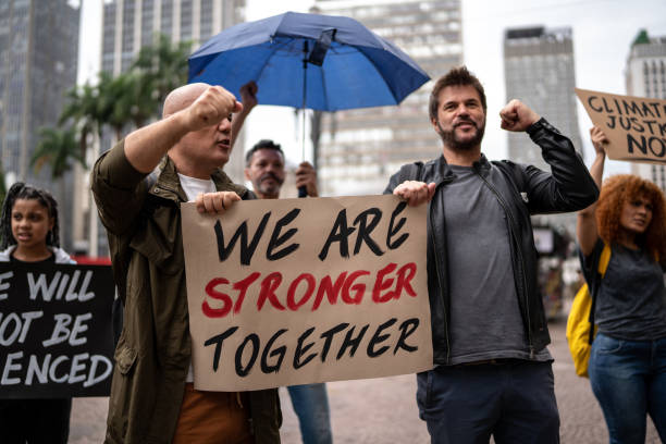 istock Protests holding signs during on a demonstration outdoors 1385767387