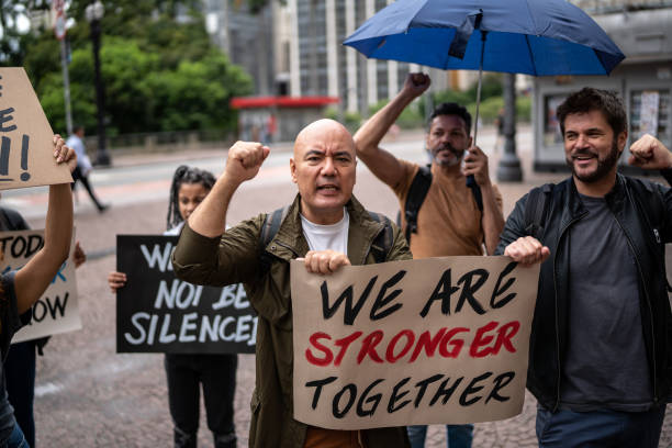 istock Protests holding signs during on a demonstration outdoors 1385767388