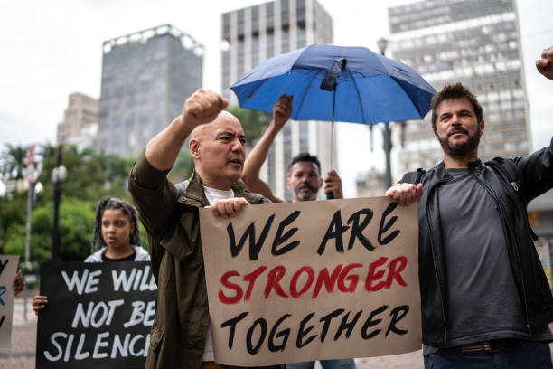 istock Protests holding signs during on a demonstration outdoors 1385767393
