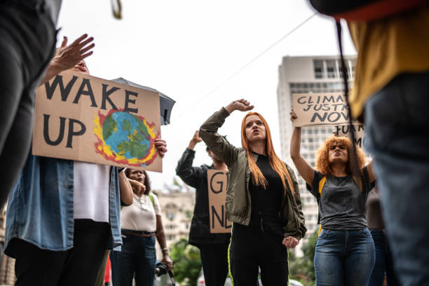 istock Protests holding signs during on a demonstration for environmentalism 1385767404