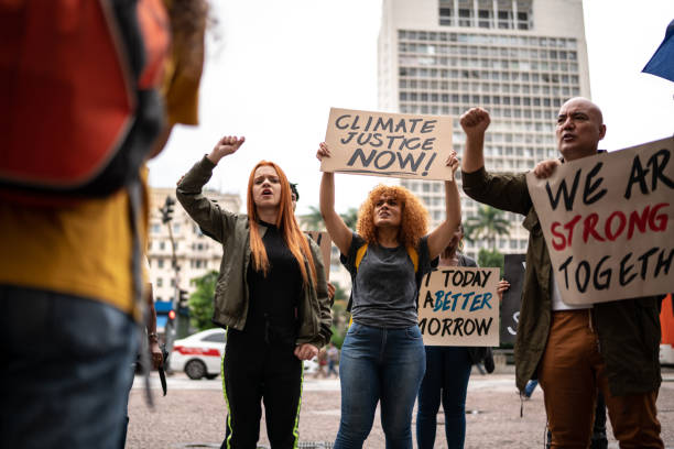 istock Protests holding signs during on a demonstration for environmentalism 1385767420