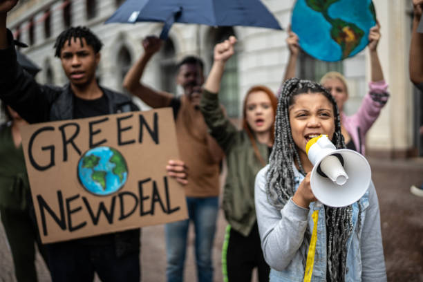 istock Protests holding signs during on a demonstration for environmentalism 1385767446