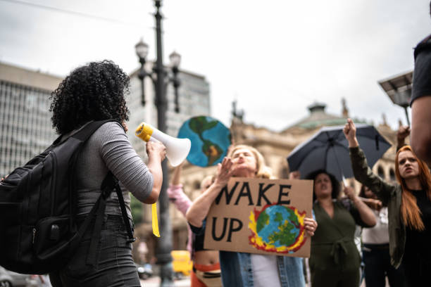 istock Protests holding signs during on a demonstration for environmentalism 1385767454