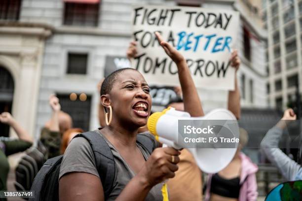Activists Doing A Demonstration Outdoors Stock Photo - Download Image Now - Protest, Anti-racism, Strike - Protest Action