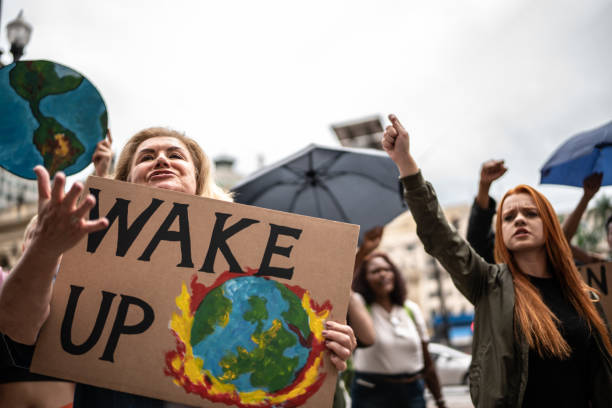istock Protests holding signs during on a demonstration for environmentalism 1385767499