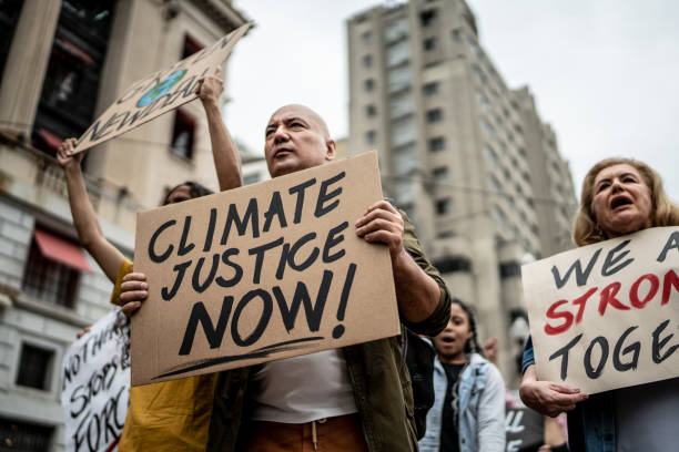 istock Protests holding signs during on a demonstration for environmentalism 1385767507