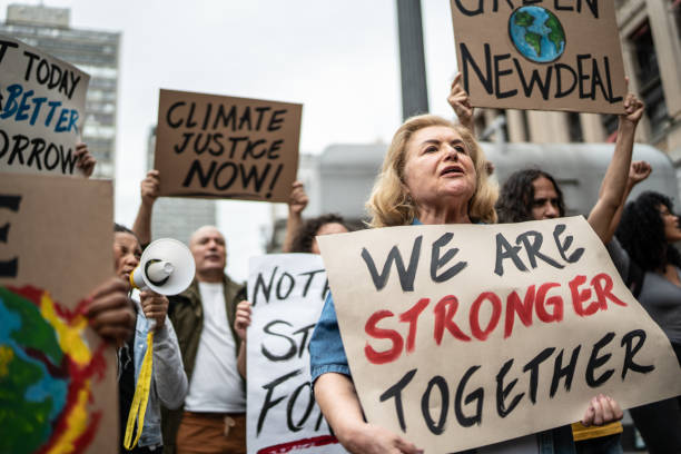 istock Protests holding signs during on a demonstration for environmentalism 1385767510