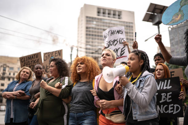 istock Protests holding signs during on a demonstration for environmentalism 1385767527