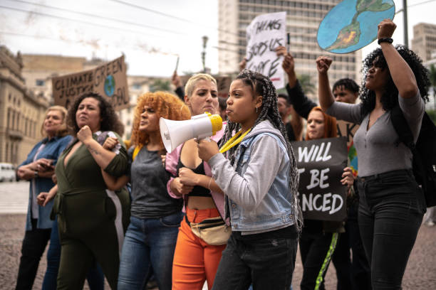 istock Protests holding signs during on a demonstration for environmentalism 1385767531