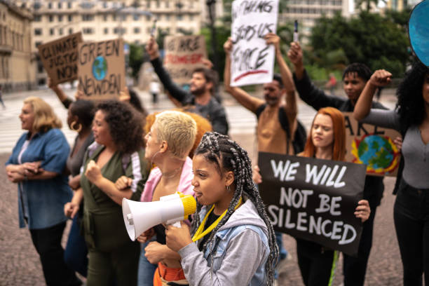 istock Protests holding signs during on a demonstration for environmentalism 1385767536