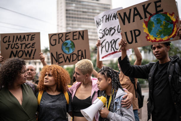 istock Protests holding signs during on a demonstration for environmentalism 1385767539