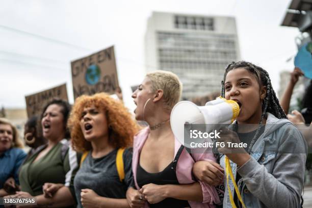 Protests Doing A Demonstration Stock Photo - Download Image Now - Protest, Megaphone, Teenager