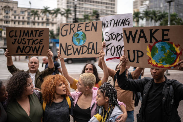 istock Protests holding signs during on a demonstration for environmentalism 1385767551
