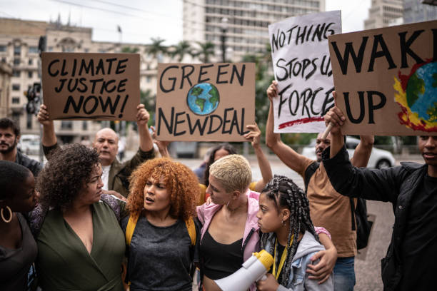 istock Protests holding signs during on a demonstration for environmentalism 1385767552