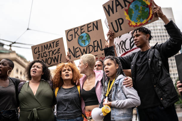 istock Protests holding signs during on a demonstration for environmentalism 1385767554