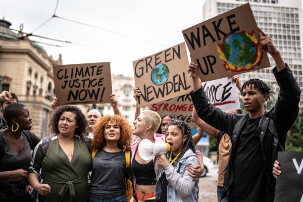 istock Protests holding signs during on a demonstration for environmentalism 1385767556