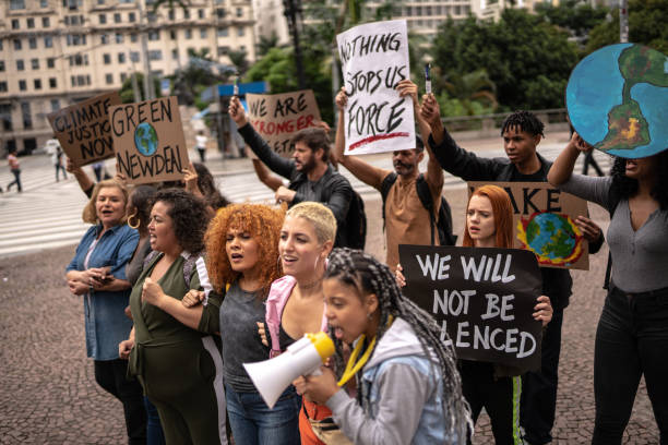 istock Protests holding signs during on a demonstration for environmentalism 1385767558