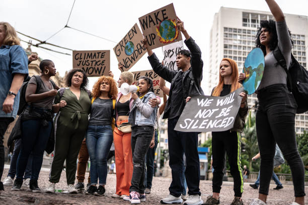istock Protests holding signs during on a demonstration for environmentalism 1385767561