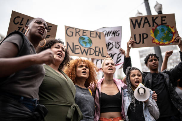 istock Protests holding signs during on a demonstration for environmentalism 1385767566