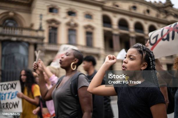 Protesters During A Demonstration In The Street Stock Photo - Download Image Now - Protest, African Ethnicity, African-American Ethnicity