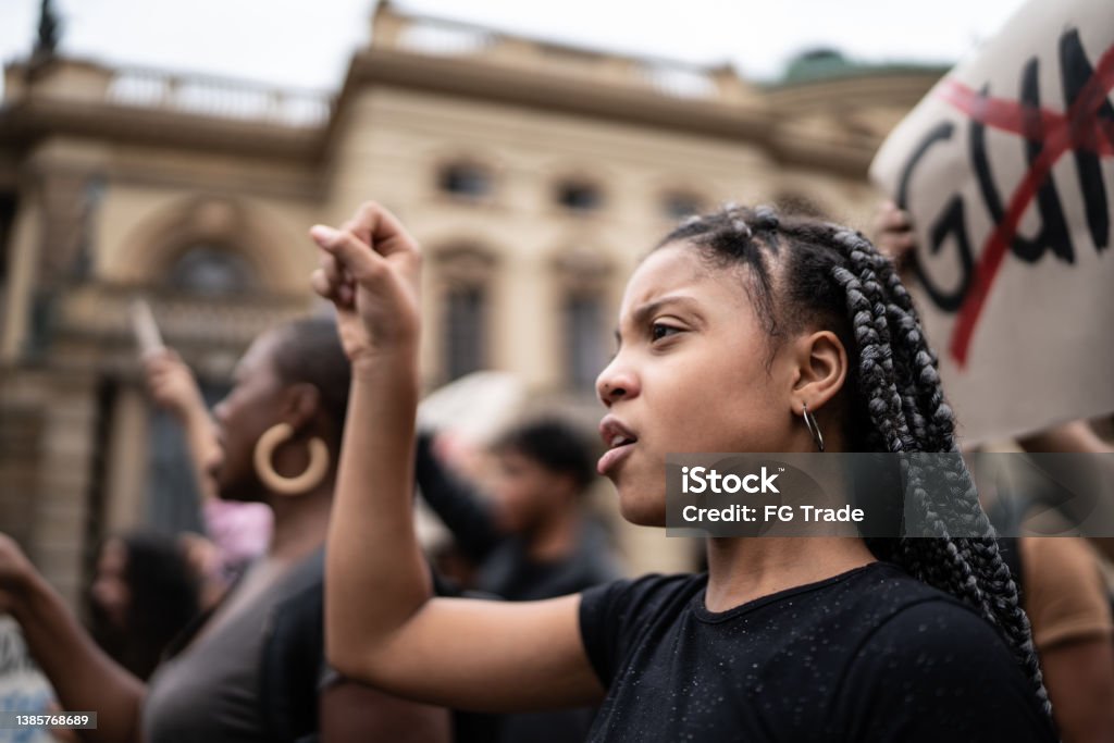 Girl during a demonstration in the street Protest Stock Photo