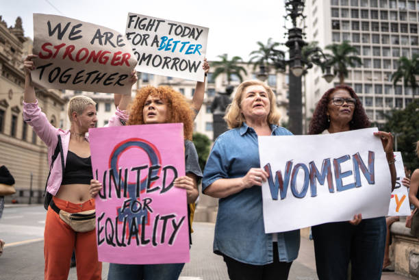 istock Protesters holding signs during a demonstration in the street 1385768698