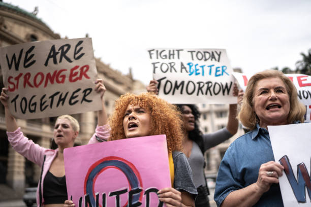 istock Protesters holding signs during a demonstration in the street 1385768715