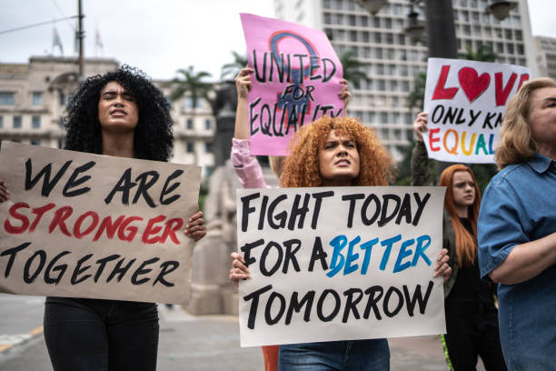 istock Protesters holding signs during a demonstration in the street 1385768720