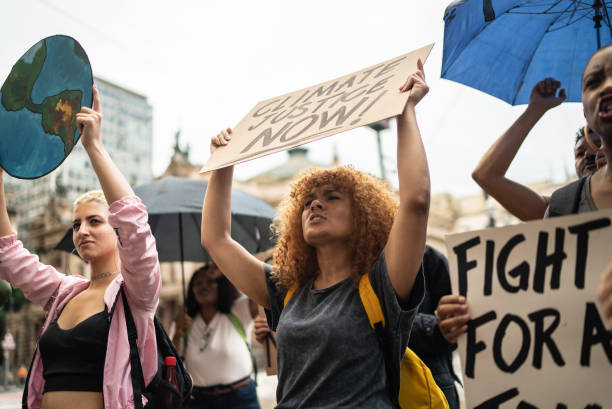 istock Protesters holding signs during a demonstration in the street 1385769171