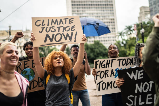 istock Protesters holding signs during a demonstration in the street 1385769175