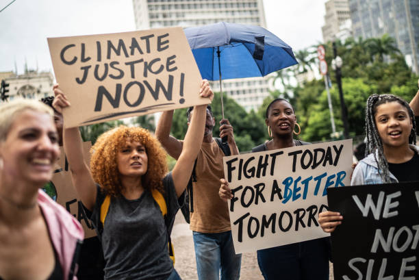 istock Protesters holding signs during a demonstration in the street 1385769189